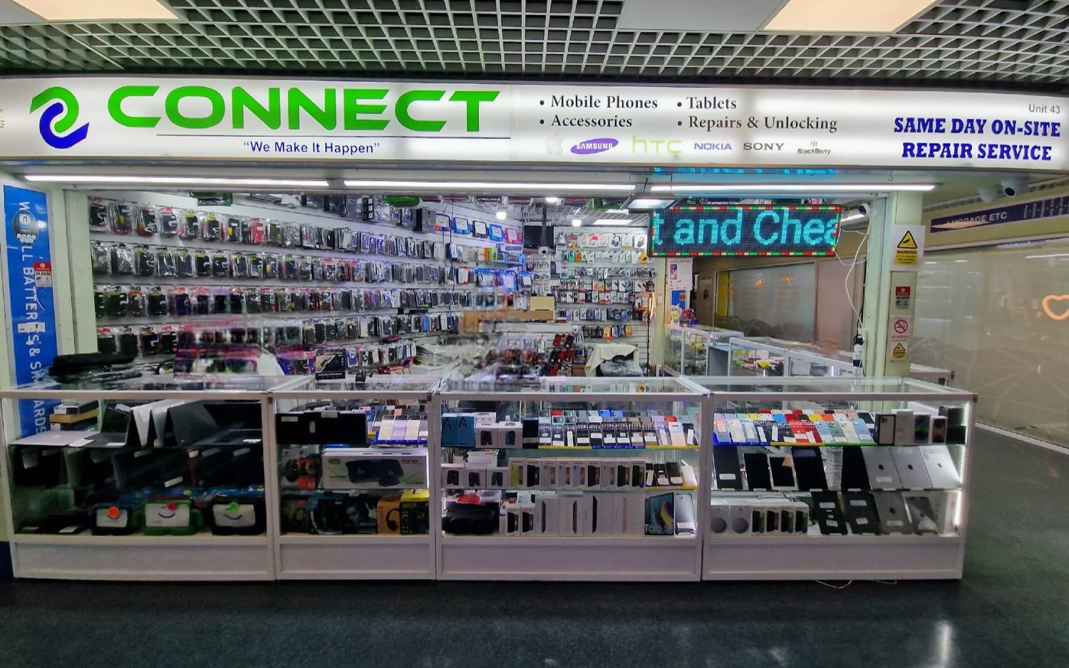 The Connect mobile phone shop counter inside the Stratford Centre, with the green and navy CONNECT signage, phone cases and handset display cabinets